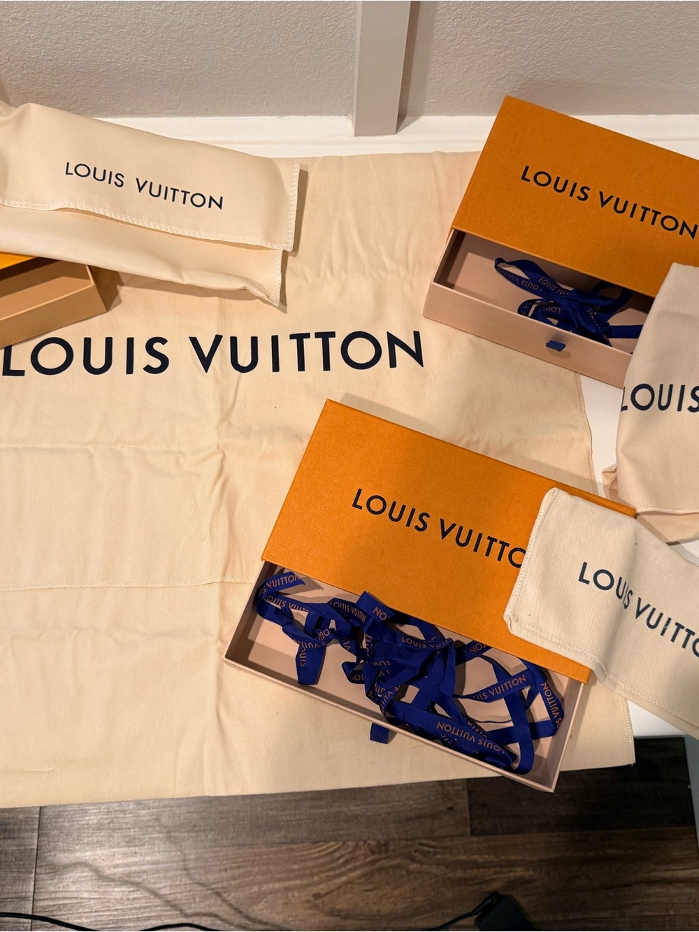 Louis Vuitton Boxes with Dusters and Blue Branded Ribbons